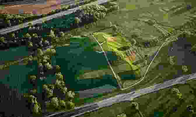 Aerial View Of Cahokia Mounds, Showing Monks Mound In The Center And The Surrounding Earthen Mounds. Cahokia Mounds: America S First City (Landmarks)